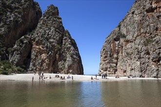 People on the beach in the gorge Torrent de Pareis