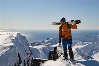 Ski mountaineer at the top of Rundfjellet