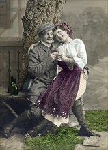 Lovers flirting and drinking wine