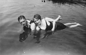 Pair bathing in lake