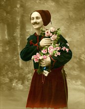 Man in traditional traditional costume with bouquet of flowers