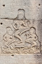 Relief showing Apsaras on a stone wall on a temple