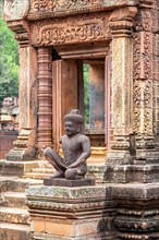 Guardian sculpture protecting the entrance to a shrine in Banteay Srei temple