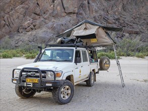 4x4 vehicle with raised roof tent