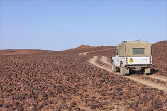 4x4 vehicle travelling on a gravel track