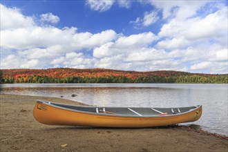 Canoeing on the shores of Canisbay Lake in Autumn