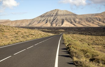 Road leading towards volcanic landscape