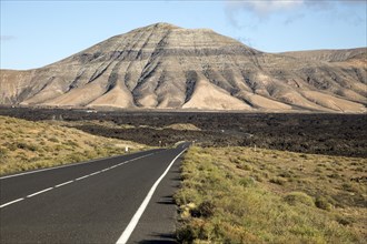 Road leading towards volcanic landscape