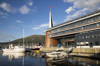 Modern architecture of Scandic Hotel with boats in harbour