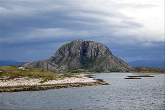 Torghatten granite mountain with a hole through it