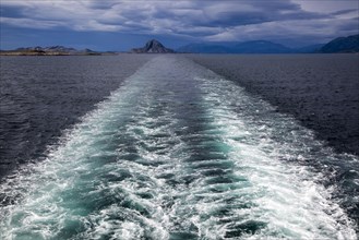 Ship's wake with view to Torghatten mountain