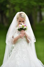 Bride in wedding dress with veil