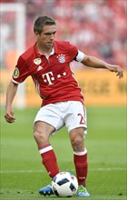 Philipp Lahm playing the ball