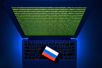 Smartphone with Russian flag on computer keyboard