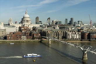 London skyline with St Paul's Cathedral and Millennium Bridge over the River Thames