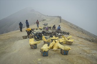 Sulphur is mined on Ijen volcano ridge