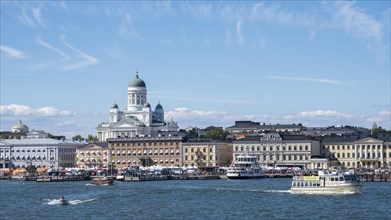 Cathedral of Helsinki behind the houses at the port