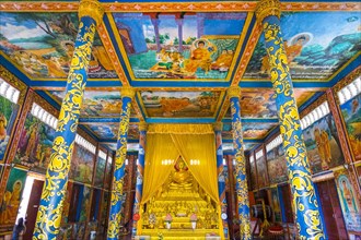 Colorful murals and altar inside Wat Krom temple