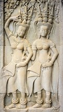Stone carvings depicting female Devatas at Angkor Wat