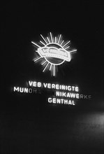 Illuminated advertising for the VEB Vereinigte Mundharmonika Werke