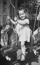 Girl drives carousel