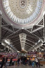 Market hall with people shopping