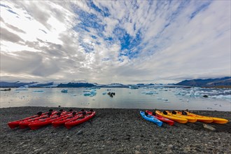 Kayaks on the shore of the glacier lagoon Jokulsarlon