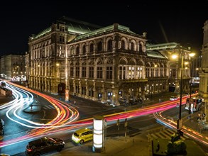 Vienna State Opera with light tracks from road traffic at night