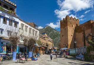 Street with tower of the Kasbah of Chefchaouen