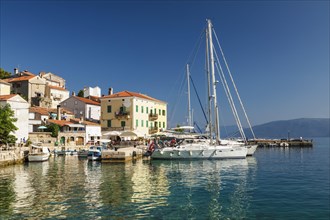 Small fishing village with sailing boats