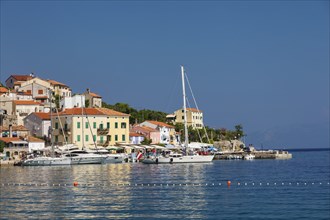 Small fishing village with sailing boats