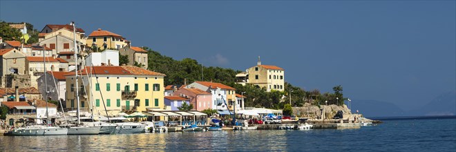 Small fishing village with sailing boats