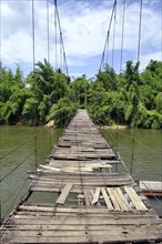 Dilapidated suspension bridge over River Kwai