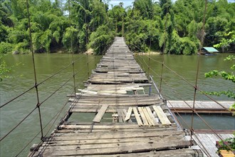 Dilapidated suspension bridge over River Kwai