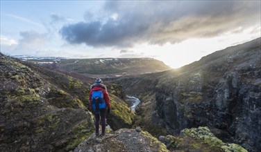 Hiker looking towards Canyon of Glymur