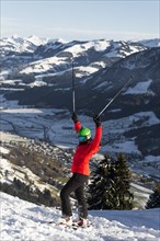 Female skier with ski helmet on the ski slope