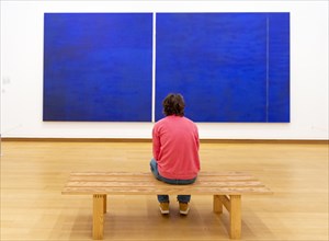 Man looking at modern art