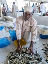 Merchant selling fresh fish