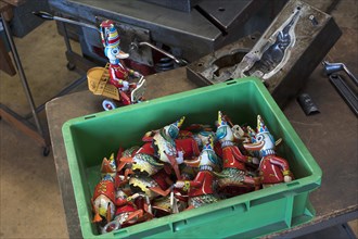 assembly box with tin toys of the 1950s