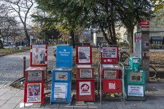 Various newspaper boxes on the street