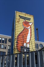 Graffiti Tiger figure on a building container