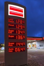 Illuminated price column of a petrol station