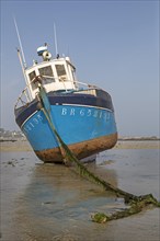 Fishing boat in the intertidal zone