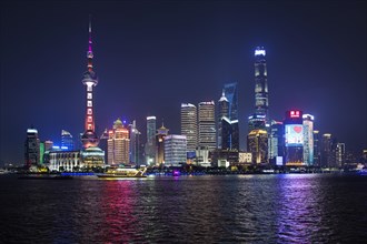 View from the Bund to the skyline at the Huangpu River with Oriental Pearl Tower