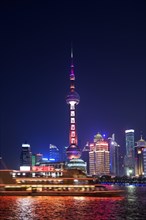 View from the Bund to the skyline at the Huangpu River with Oriental Pearl Tower