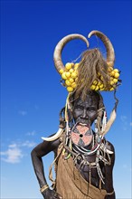 Woman with large lip plate and horns