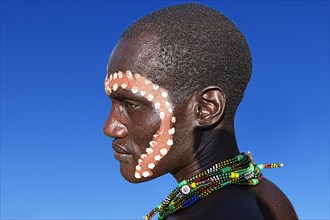 Man with ritual face painting for the cattle jump ritual
