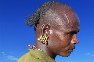 Man with earrings in ear