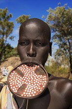 Woman with large lip plate