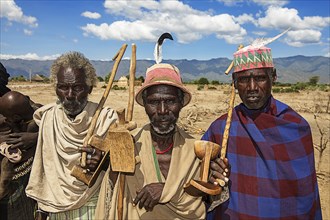 Men of the Erbore tribe with hats and sticks